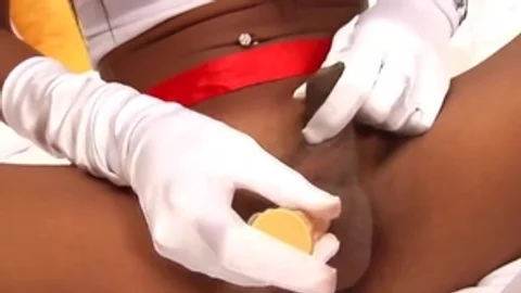 Tanned Ladyboy Nurse Teases With Her big breasts And long cock